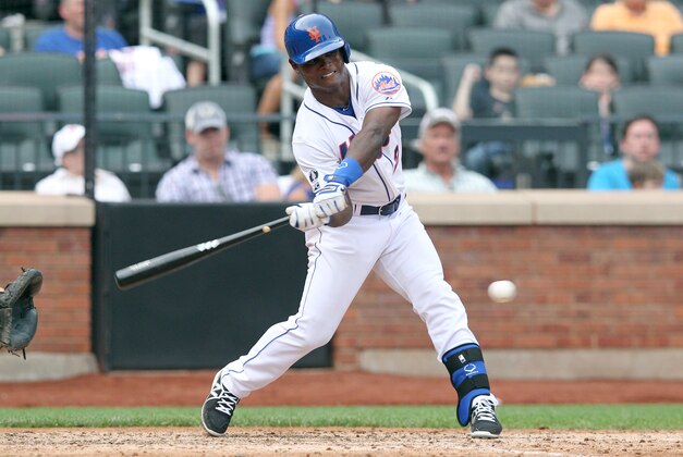 Aug 31, 2014; New York, NY, USA; New York Mets second baseman Dilson Herrera (2) hits an RBI single against the Philadelphia Phillies during the eighth inning of a game at Citi Field. The RBI was the first in Herrera's MLB career. Mandatory Credit: Brad Penner-USA TODAY Sports