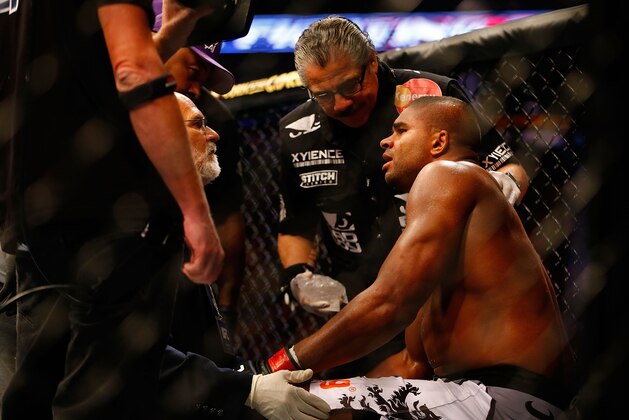 BOSTON, MA - AUGUST 17: Alistair Overeem sits in the corner and is tended to by medical staff after being knocked out by Travis Browne in their heavyweight bout at TD Garden on August 17, 2013 in Boston, Massachusetts. (Photo by Jared Wickerham/Getty Images)