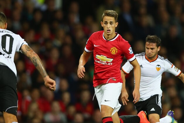MANCHESTER, ENGLAND - AUGUST 12:  Adnan Januzaj of Manchester United attempts to move past Nicolas Otamendi of Valencia during the Pre Season Friendly match between Manchester United and Valencia at Old Trafford on August 12, 2014 in Manchester, England.  (Photo by Clive Brunskill/Getty Images)