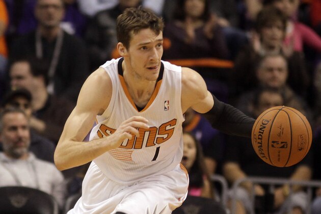 Phoenix Suns shooting guard Goran Dragic (1) carries the ball against the Charlotte Bobcats in the third quarter during an NBA basketball game, Saturday, Feb. 1, 2014, in Phoenix. (AP Photo/Rick Scuteri)