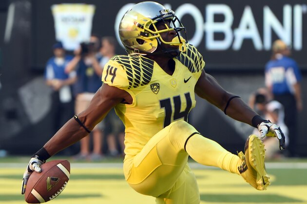 EUGENE, OR -SEPTEMBER 06: Defensive back Ifo Ekpre-Olomu #14 of the Oregon Ducks celebrates after intercepting a pass during the fourth quarter of the game against the Michigan State Spartans at Autzen Stadium on September 6, 2014 in Eugene, Oregon. Oregon won the game 46-27. (Photo by Steve Dykes/Getty Images)