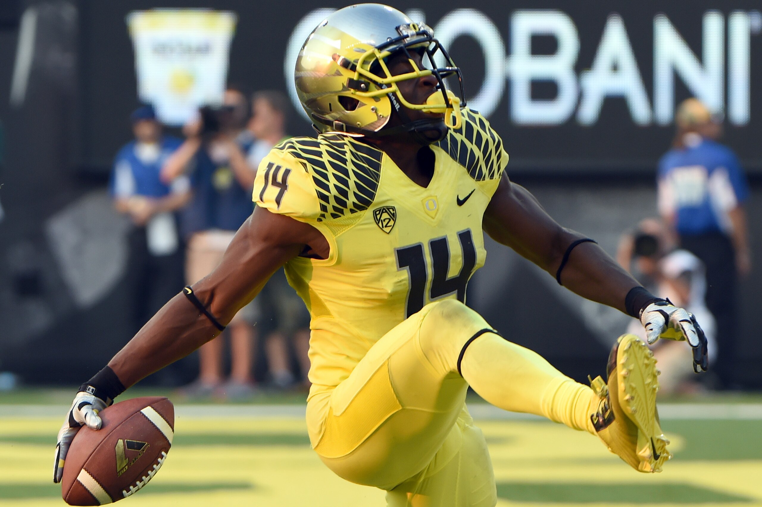 EUGENE, OR -SEPTEMBER 06: Defensive back Ifo Ekpre-Olomu #14 of the Oregon Ducks celebrates after intercepting a pass during the fourth quarter of the game against the Michigan State Spartans at Autzen Stadium on September 6, 2014 in Eugene, Oregon. Oregon won the game 46-27. (Photo by Steve Dykes/Getty Images)