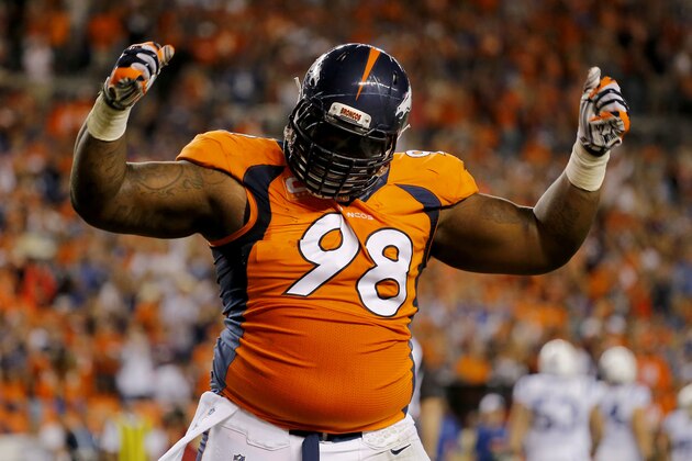 Denver Broncos defensive tackle Terrance Knighton (98) celebrates a stop during the second half of an NFL football game against the Indianapolis Colts, Sunday, Sept. 7, 2014, in Denver. The Broncos won 31-24. (AP Photo/Jack Dempsey)