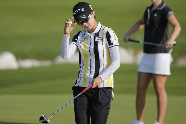 Hyo Joo Kim, of South Korea, acknowledges the crowd after finishing the first round of the Evian Championship women's golf tournament in Evian, eastern France, Thursday, Sept. 11, 2014. (AP Photo/Laurent Cipriani)