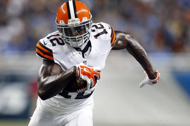 FILE - In this Aug. 9, 2014, file photo, Cleveland Browns wide receiver Josh Gordon (12) runs with the ball  in the first half of a preseason NFL football game against the Detroit Lions at Ford Field in Detroit. A person familiar with Gordon's situation says the suspended wide receiver wants to play in the Canadian Football League, but is prohibited from doing so. Under CFL rules, a player suspended by the NFL and under contract is not eligible to play in Canada. But if the Browns released Gordon, he would be able to play elsewhere.   (AP Photo/Rick Osentoski, File)