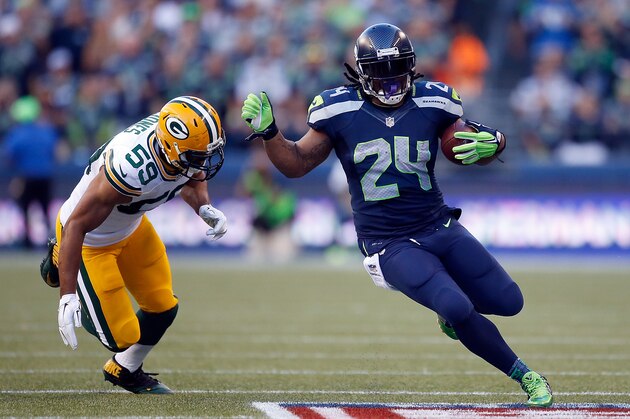 SEATTLE, WA - SEPTEMBER 04: Running back Marshawn Lynch #24 of the Seattle Seahawks runs with the ball as linebacker Brad Jones #59 of the Green Bay Packers tries to catch him during the second quarter of the game at CenturyLink Field on September 4, 2014 in Seattle, Washington.  (Photo by Otto Greule Jr/Getty Images)