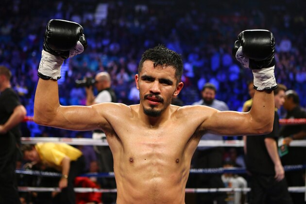 LAS VEGAS, NV - DECEMBER 08:  (L-R) Miguel Angel Vazquez celebrates after the 12th round against Mercito Gesta after their IBF world lightweight title fight at the MGM Grand Garden Arena on December 8, 2012 in Las Vegas, Nevada. Vazquez defeated Gesta by unanimous decision.  (Photo by Al Bello/Getty Images)