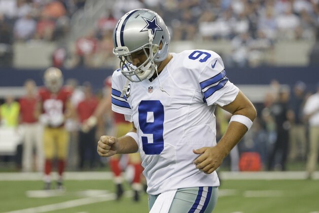 Dallas Cowboys quarterback Tony Romo (9) heads toward the sidelines after a turnover to the San Francisco 49ers in the first half of an NFL football game, Sunday, Sept. 7, 2014, in Arlington, Texas. (AP Photo/Tony Gutierrez)