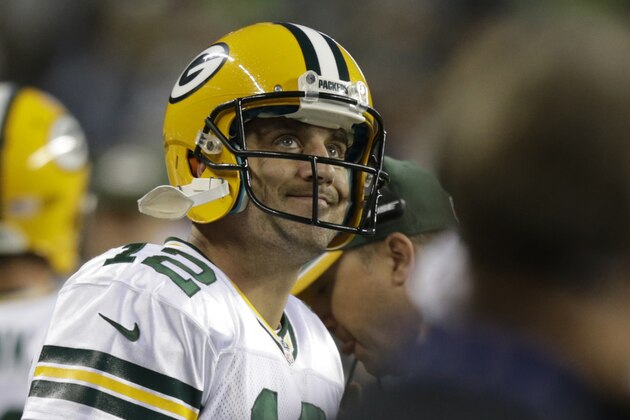 Green Bay Packers quarterback Aaron Rodgers looks at the scoreboard in the second half of an NFL football game against the Seattle Seahawks, Thursday, Sept. 4, 2014, in Seattle. (AP Photo/Stephen Brashear)