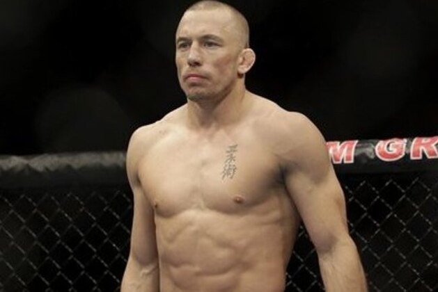 Georges St. Pierre, of Canada, waits to begin a UFC 167 mixed martial arts championship welterweight bout against Johny Hendricks on Saturday, Nov. 16, 2013, in Las Vegas. St. Pierre won by split decision. (AP Photo/Isaac Brekken) Georges St. Pierre, of Canada, waits to begin a UFC 167 mixed martial arts championship welterweight bout against Johny Hendricks on Saturday, Nov. 16, 2013, in Las Vegas. St. Pierre won by split decision. (AP Photo/Isaac Brekken)
