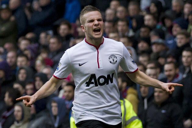 Manchester United's Tom Cleverley celebrates after scoring against Aston Villa during their English Premier League soccer match at Villa Park Stadium, Birmingham, England, Sunday Dec. 15, 2013. (AP Photo/Jon Super)