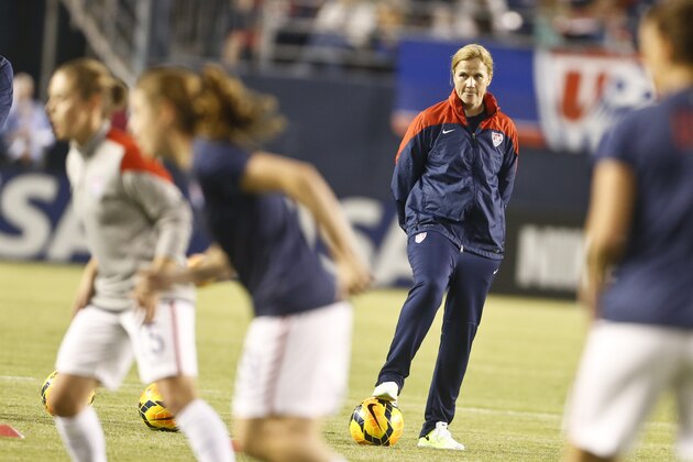 US soccer interim head coach Jill Ellis watches her team prepare for a soccer match against China Thursday, April 10, 2014, in San Diego. (AP Photo/Lenny Ignelzi)