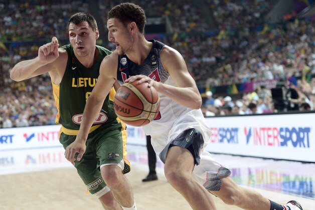United States's Klay Thompson, right, is challenged by Lithuania's Jonas Maciulis during their Basketball World Cup semifinal match at the Palau Sant Jordi in Barcelona, Spain, Thursday, Sept. 11, 2014. The 2014 Basketball World Cup competition will take place in various cities in Spain from Aug. 30 through Sept. 14. (AP Photo/Manu Fernandez)
