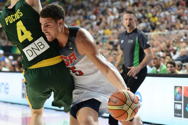 BARCELONA, SPAIN - SEPTEMBER 11: Klay Thompson #5 of the USA Basketball Men's National Team drives against Martynas Pocius #4 of the Lithuania National Team during the 2014 FIBA World Cup Semi-Finals at Palau Sant Jordi on September 11, 2014 in Barcelona, Spain.  NOTE TO USER: User expressly acknowledges and agrees that, by downloading and/or using this Photograph, user is consenting to the terms and conditions of the Getty Images License Agreement. Mandatory Copyright Notice: Copyright 2014 NBAE (Photo by Garrett Ellwood/NBAE via Getty Images)