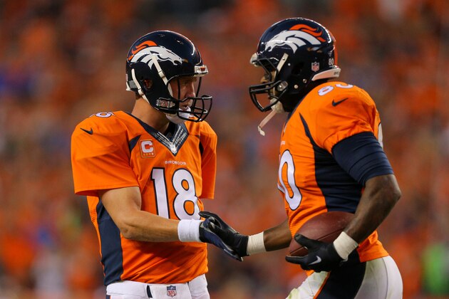 DENVER, CO - SEPTEMBER 7:  Quarterback Peyton Manning #18 of the Denver Broncos and tight end Julius Thomas #80 celebrate Thomas' second touchdown of the first half during a game against the Indianapolis Colts at Sports Authority Field at Mile High on September 7, 2014 in Denver, Colorado.  (Photo by Justin Edmonds/Getty Images)