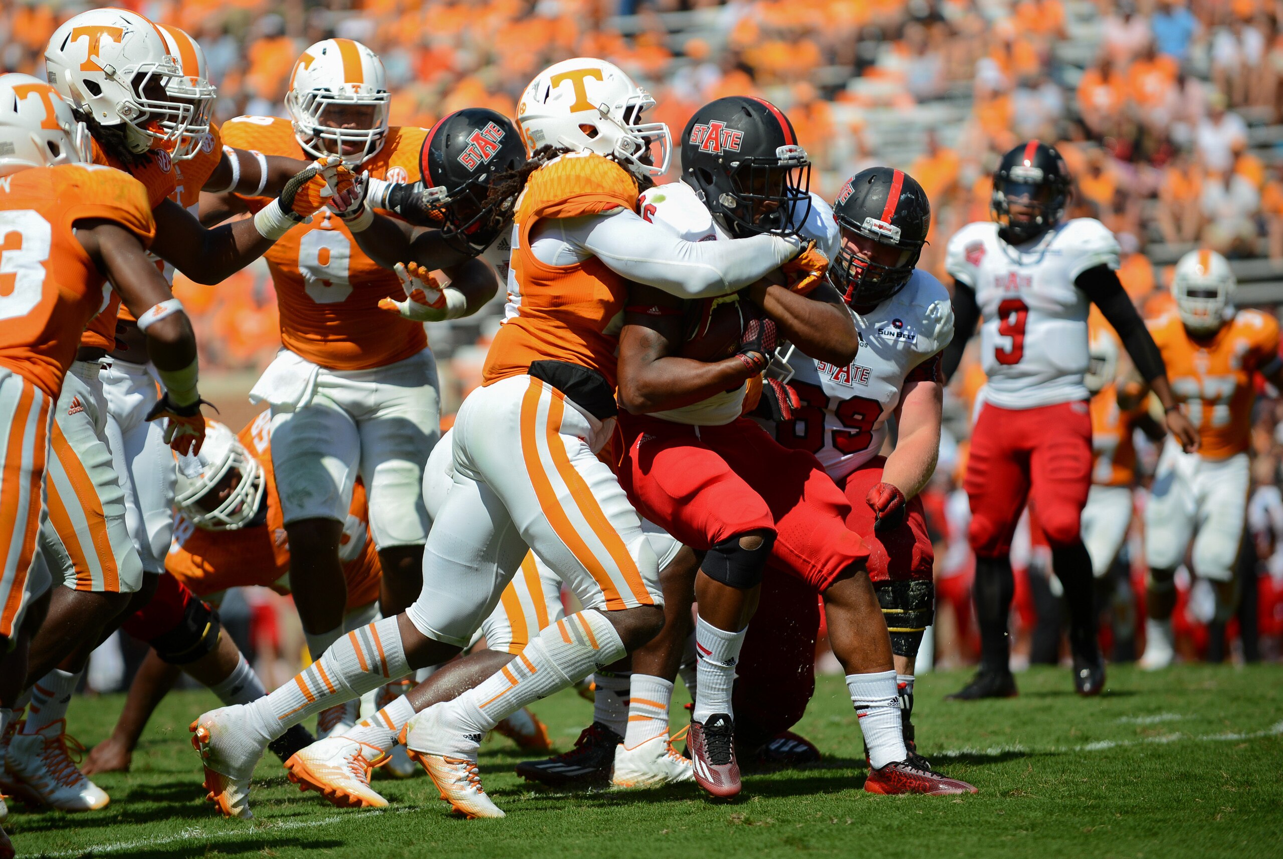 Sep 6, 2014; Knoxville, TN, USA; Arkansas State Red Wolves wide receiver DeKeathan Williams (26) is tackled by Tennessee Volunteers linebacker A.J. Johnson (45) during the second half at Neyland Stadium. Tennessee won 34 to 19. Mandatory Credit: Randy Sartin-USA TODAY Sports