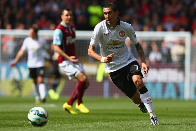 BURNLEY, ENGLAND - AUGUST 30: Angel di Maria of Manchester United runs with the ball during the Barclays Premier League match between Burnley and Manchester United at Turf Moor on August 30, 2014 in Burnley, England.  (Photo by Clive Brunskill/Getty Images)