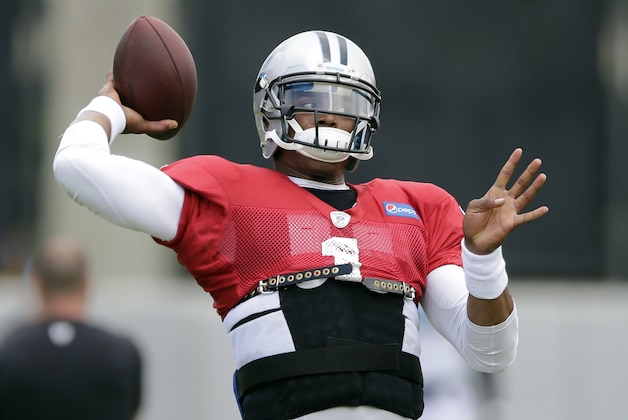 Carolina Panthers' Cam Newton throws a pass during an NFL football practice in Charlotte, N.C., Wednesday, Sept. 10, 2014. Panthers coach Ron Rivera said Monday he expected Newton to start against the Detroit Lions on Sunday after missing the season opener at Tampa Bay with a rib injury. (AP Photo/Chuck Burton)