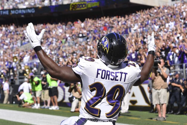 Sep 7, 2014; Baltimore, MD, USA; Baltimore Ravens running back Justin Forsett (29) celebrates after scoring a 13-yard touchdown during the third quarter against the Cincinnati Bengals at M&T Bank Stadium. Mandatory Credit: Tommy Gilligan-USA TODAY Sports