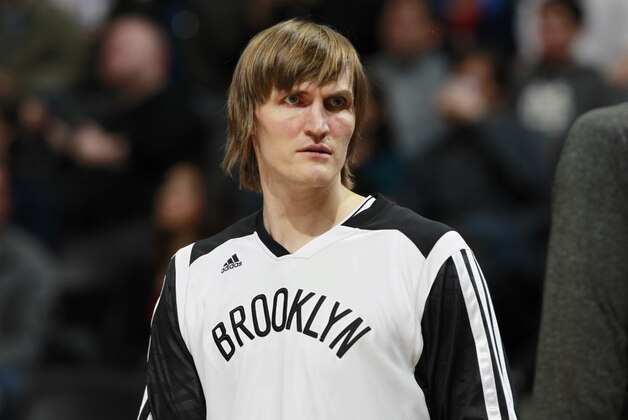 FILE - This Feb. 27, 2014 file photo showing Brooklyn Nets forward Andrei Kirilenko, of Russia, during an NBA game against the Denver Nuggets, in Denver. The Nets say Kirilenko has opted to remain with the team for the second year of his contract. Kirilenko will make $3.3 million next season in the final year of a two-year, $6.5 million deal he signed last summer. (AP Photo/David Zalubowski, File)
