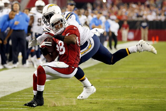 Arizona Cardinals running back Andre Ellington (38) is tackled by San Diego Chargers outside linebacker Melvin Ingram during the second half of an NFL football game, Monday, Sept. 8, 2014, in Glendale, Ariz. (AP Photo/Ross D. Franklin)
