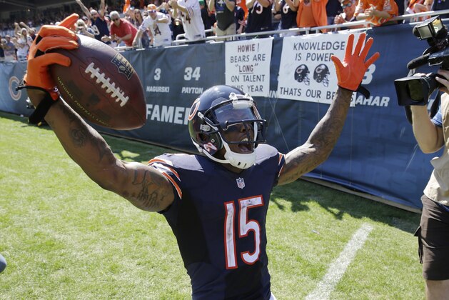 Chicago Bears wide receiver Brandon Marshall (15) celebrates in the end zone after a touchdown reception against the Buffalo Bills during the second half of an NFL football game Sunday, Sept. 7, 2014, in Chicago. (AP Photo/Nam Y. Huh)