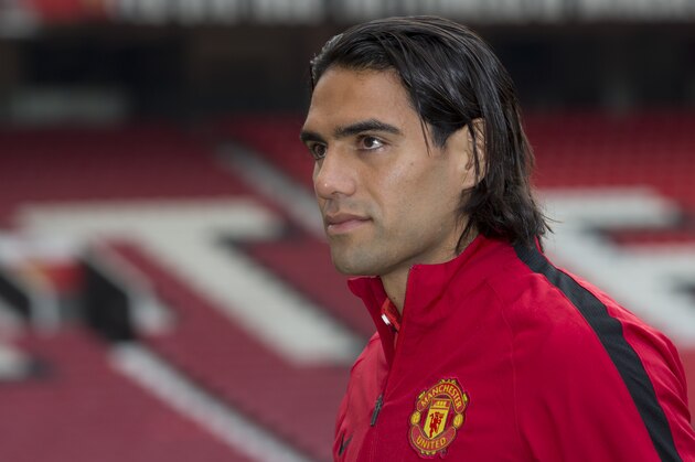 Manchester United's new player Radamel Falcao walks across the pitch at Old Trafford Stadium, Manchester, England, Thursday Sept. 11, 2014. The Colombian striker Falcao joined on a season-long loan deal from Ligue 1 side Monaco as Louis van Gaal looks to bolster his attacking options. (AP Photo/Jon Super)