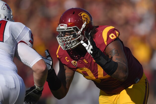 Southern California defensive end Leonard Williams, right, battles with Fresno State offensive linesman Justin Northern during the first half of an NCAA college football game, Saturday, Aug. 30, 2014, in Los Angeles. (AP Photo/Mark J. Terrill)
