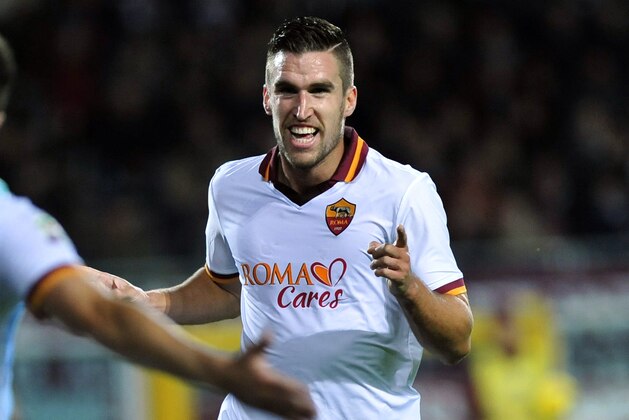 AS Roma's Kevin Strootman, of the Netherland, right, celebrates after scoring during a Serie A soccer match between FC Torino and  AS Roma at the Turin's Olympic stadium, Italy, Sunday, Nov. 3, 2013. (AP Photo/Massimo Pinca)