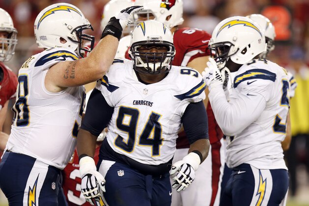 San Diego Chargers defensive end Corey Liuget (94) celebrates his sack against the Arizona Cardinals during the first half of an NFL football game, Monday, Sept. 8, 2014, in Glendale, Ariz. (AP Photo/Ross D. Franklin)