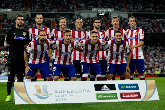 MADRID, SPAIN - AUGUST 19: Atletico de Madrid line up prior to start the Supercopa first leg match between Real Madrid and Club Atletico de Madrid at Estadio Santiago Bernabeu on August 19, 2014 in Madrid, Spain.  (Photo by Gonzalo Arroyo Moreno/Getty Images)