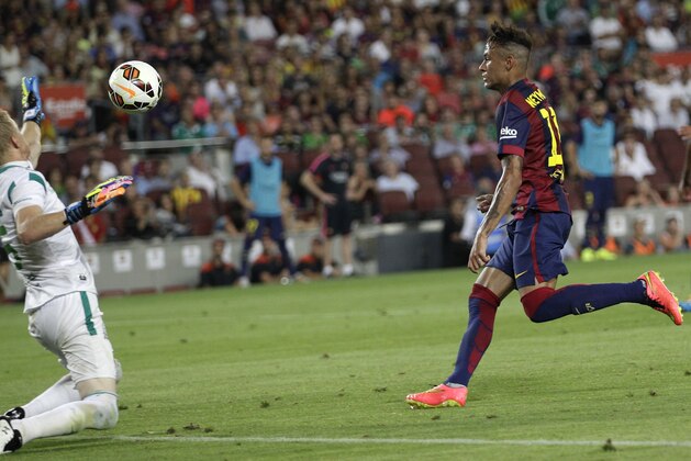 Barcelona's Neymar, from Brazil, scores his side's third goal during the Joan Gamper trophy friendly soccer match between Barcelona and Leon at the Camp Nou stadium in Barcelona, Spain, Monday, Aug. 18, 2014. (AP Photo/Emilio Morenatti)