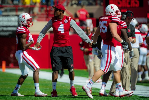 LINCOLN, NE - SEPTEMPER 6: Defensive end Randy Gregory #4 of the Nebraska Cornhuskers greets teammates during their game against the McNeese State Cowboys at Memorial Stadium on September 6, 2014 in Lincoln, Nebraska. Gregory missed the game due to injury. (Photo by Eric Francis/Getty Images)