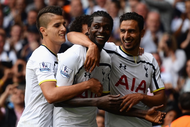 LONDON, ENGLAND - AUGUST 24:  Emmanuel Adebayor of Spurs celebrates his goal with team mates during the Barclays Premier League match between Tottenham Hotspur and Queens Park Rangers at White Hart Lane on August 24, 2014 in London, England.  (Photo by Jamie McDonald/Getty Images)