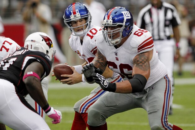 New York Giants' David Diehl (66) blocks Arizona Cardinals' Vonnie Holliday, left, as Giants' Eli Manning (10) takes the snap during an NFL football game, Sunday, Oct. 2, 2011, in Glendale, Ariz. The Giants defeated the Cardinals 31-27. (AP Photo/Ross D. Franklin) New York Giants' David Diehl (66) blocks Arizona Cardinals' Vonnie Holliday, left, as Giants' Eli Manning (10) takes the snap during an NFL football game, Sunday, Oct. 2, 2011, in Glendale, Ariz. The Giants defeated the Cardinals 31-27. (AP Photo/Ross D. Franklin)
