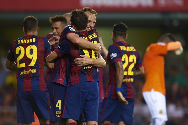 VILLARREAL, SPAIN - AUGUST 31:  Ivan Rakitic of Barcelona celebrates with his teammate Jordi Alba during the La Liga match between Villarreal CF and FC Barcelona at El Madrigal stadium on August 31, 2014 in Villarreal, Spain.  (Photo by Manuel Queimadelos Alonso/Getty Images)