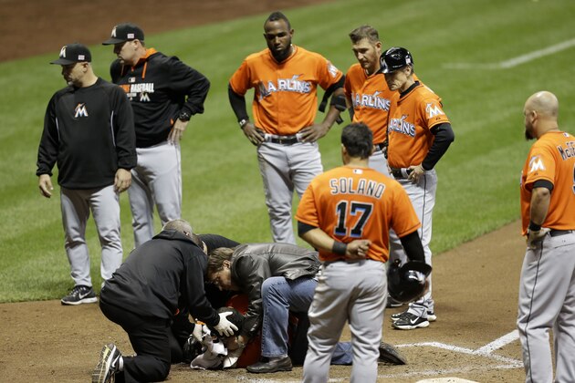 MILWAUKEE, WI - SEPTEMBER 11: Giancarlo Stanton #27 of the Miami Marlins lies on the ground after getting hit by a pitch from Mike Fiers of the Milwaukee Brewers during the top of the fifth inning at Miller Park on September 11, 2014 in Milwaukee, Wisconsin. (Photo by Mike McGinnis/Getty Images)