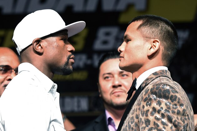 LAS VEGAS, NV - SEPTEMBER 10:  WBC/WBA welterweight champion Floyd Mayweather Jr. (L) and Marcos Maidana face off during a news conference at the MGM Grand Hotel/Casino on September 10, 2014 in Las Vegas, Nevada. Mayweather Jr. will defend his titles against Maidana on September 13 in Las Vegas.  (Photo by Ethan Miller/Getty Images)