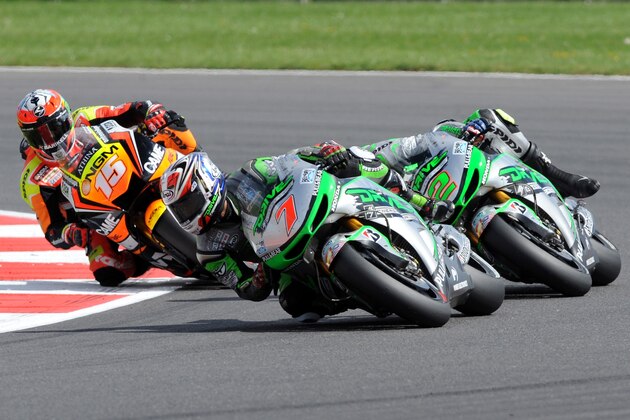 Japan's Hiroshi Aoyama of Drive M7 Honda, center,  during the British Grand Prix Moto GP race at Silverstone, England, Sunday, Aug. 31, 2014. (AP Photo/Rui Vieira)