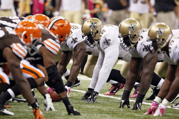 Members of the Cleveland Browns and New Orleans Saints line up before a play during an NFL football game at the Louisiana Superdome in New Orleans, Sunday, Oct. 24, 2010. (AP Photo/Patrick Semansky)