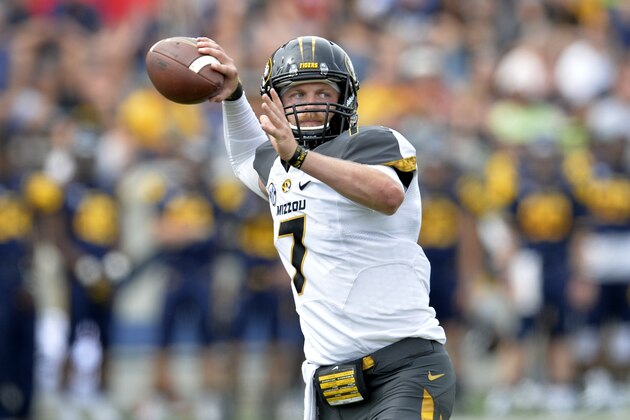 Missouri Tigers quarterback Maty Mauk (7) throws a pass in the fourth quarter of a 49-24 win over the Toledo Rockets in an NCAA college football game in Toledo, Ohio, Saturday, Sept. 6, 2014. (AP Photo/David Richard)