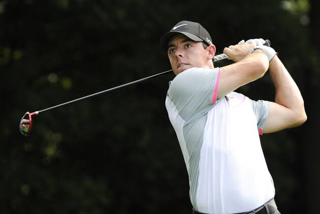 Rory Mcilroy, of Northern Ireland, hits from the tee on the third hole during the second round of play in the Tour Championship golf tournament  Friday, Sept. 12, 2014, in Atlanta. (AP Photo/John Amis)