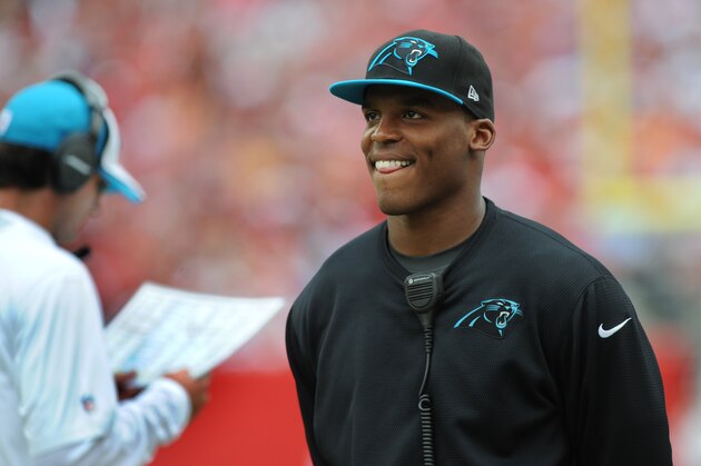 TAMPA, FL - SEPTEMBER 7: Quarterback Cam Newton #1 of the Carolina Panthers watches the game against the Tampa Bay Buccaneers from the sidelines at Raymond James Stadium on September 7, 2014 in Tampa, Florida. (Photo by Cliff McBride/Getty Images)