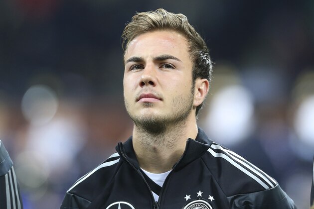 Germany midfielder Mario Gotze stands prior to the start of a friendly soccer match between Italy and Germany at the San Siro  stadium in Milan, Italy, Friday, Nov. 15, 2013. (AP Photo/Antonio Calanni)