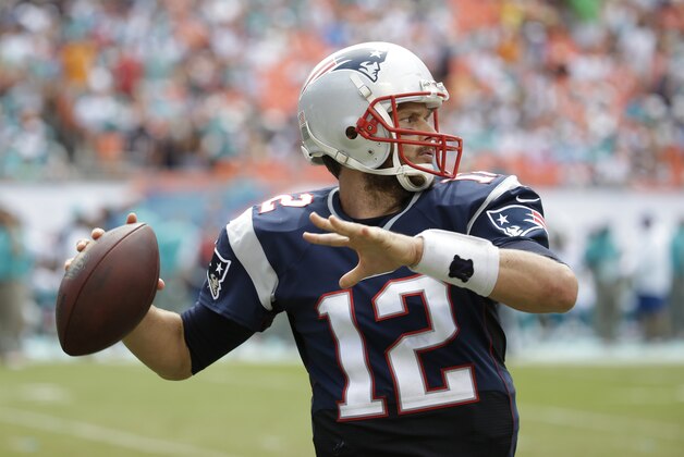 New England Patriots quarterback Tom Brady (12) looks to pass during the second half of an NFL football game against the Miami Dolphins, in Miami Gardens, Fla., Sunday Sept. 7, 2014. (AP PhotoLynne Sladky)