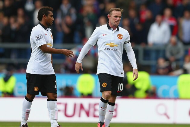 BURNLEY, ENGLAND - AUGUST 30:  Anderson of Manchester United talks to Wayne Rooney of Manchester United during the Barclays Premier League match between Burnley and Manchester United at Turf Moor on August 30, 2014 in Burnley, England.  (Photo by Clive Brunskill/Getty Images)