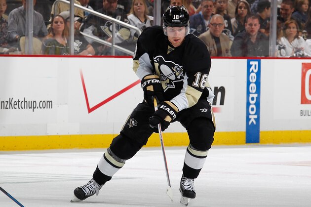 PITTSBURGH, PA - APRIL 19:  James Neal #18 of the Pittsburgh Penguins moves the puck against theColumbus Blue Jackets in Game Two of the First Round of the 2014 Stanley Cup Playoffs at Consol Energy Center on April 19, 2014 in Pittsburgh, Pennsylvania.  (Photo by Gregory Shamus/NHLI via Getty Images)