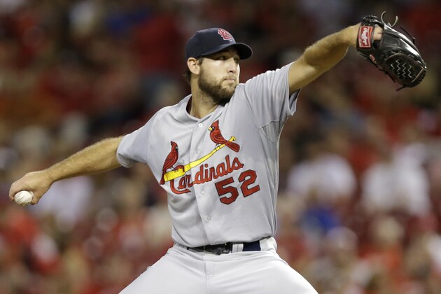 St. Louis Cardinals starting pitcher Michael Wacha throws against the Cincinnati Reds in the fourth inning of a baseball game, Tuesday, Sept. 9, 2014, in Cincinnati. (AP Photo/Al Behrman)
