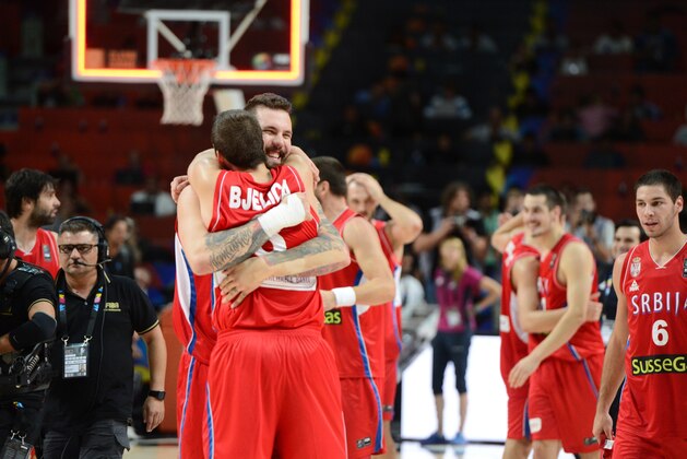MADRID, SPAIN - SEPTEMBER 12: Miroslav Raduljica #13 and Nemanja Bjelica #8 of the Serbia National Team celebrates after defeating against the France National Team at Palacio de Deportes on September 12, 2014 in Madrid, Spain.  NOTE TO USER: User expressly acknowledges and agrees that, by downloading and/or using this Photograph, user is consenting to the terms and conditions of the Getty Images License Agreement. Mandatory Copyright Notice: Copyright 2014 NBAE (Photo by Garrett Ellwood/NBAE via Getty Images)