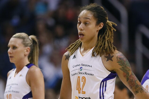 Phoenix Mercury center Brittney Griner (42) walks to the bench after getting a cut above her eye during the first half of  Game 2 of the WNBA basketball finals against the Chicago Sky, Tuesday, Sept. 9, 2014, in Phoenix. (AP Photo/Matt York)